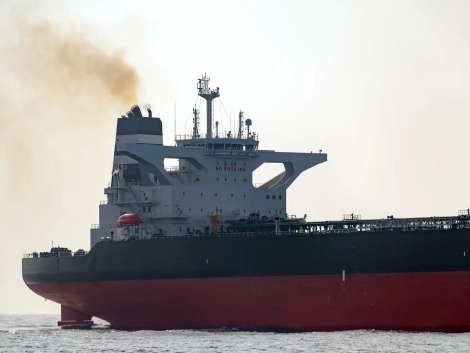 Wheelhouse tanker with an exhaust pipe, open sea.